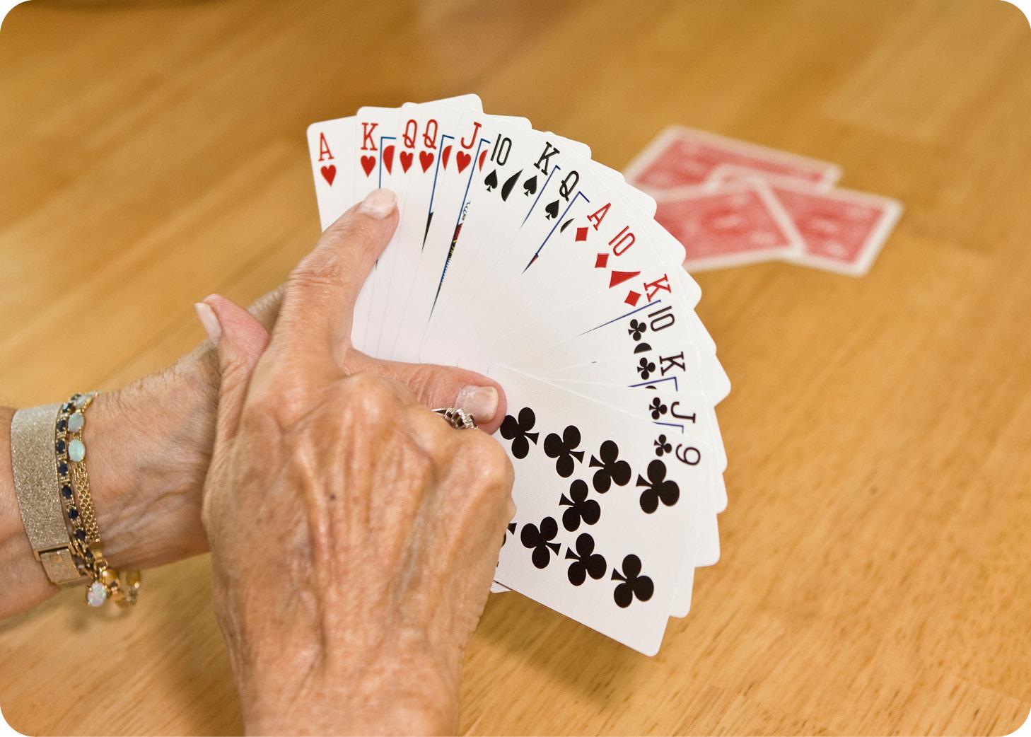 Woman's hands playing cards