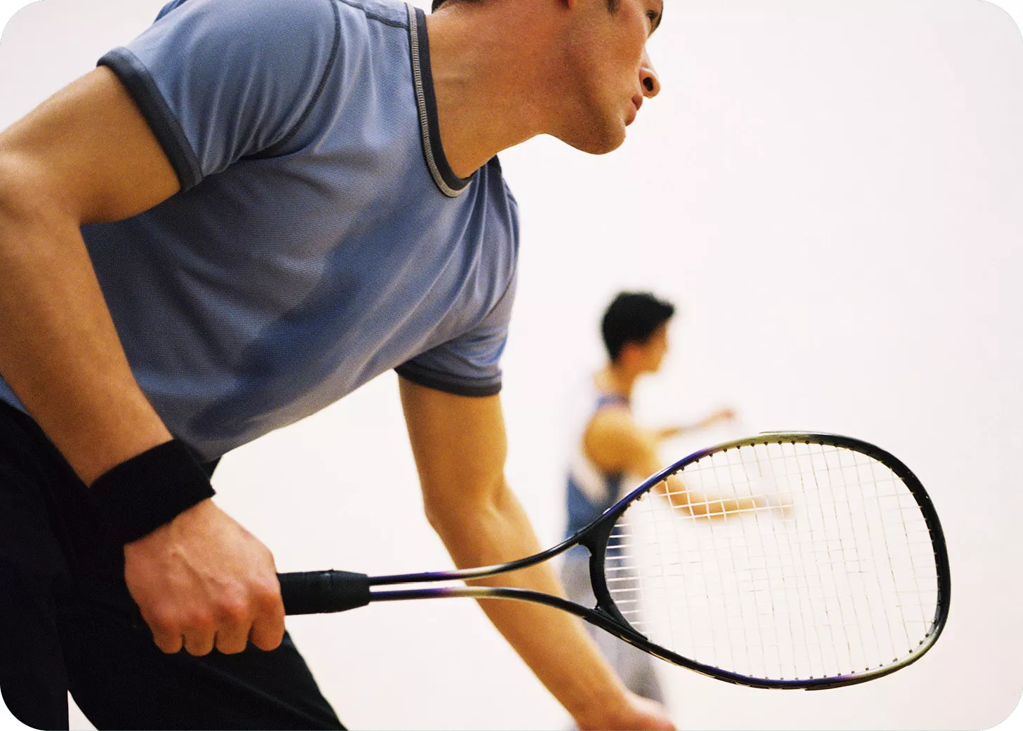 Image of 2 men playing racquetball