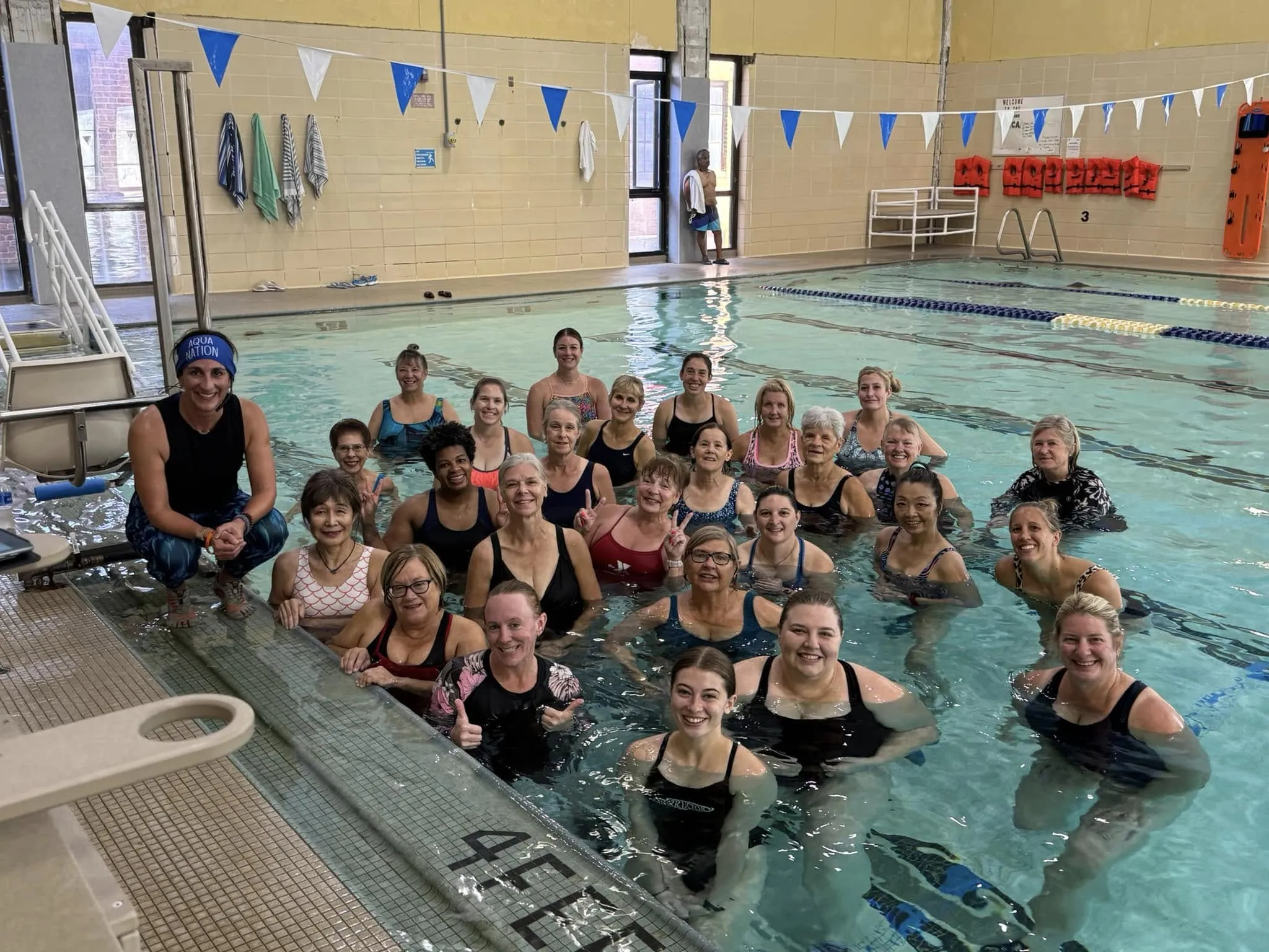 group of people swimming 