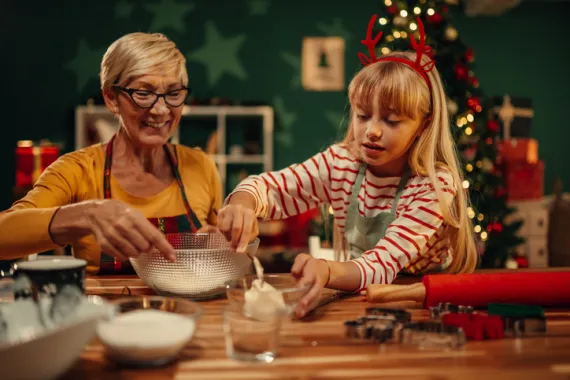 grandma and granddaughter baking 
