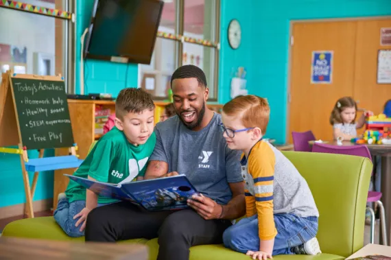 staff member reading to kids 