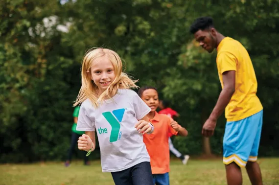 Y kids running on green field