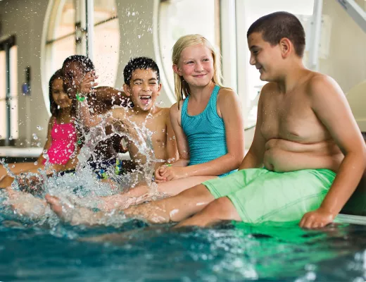 Kids splashing in the pool