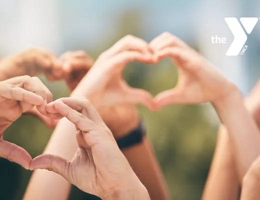 close up of hands forming a heart shape