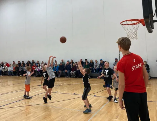 staff member officiating a basketball game