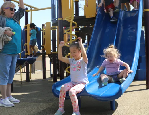 kids going down slide