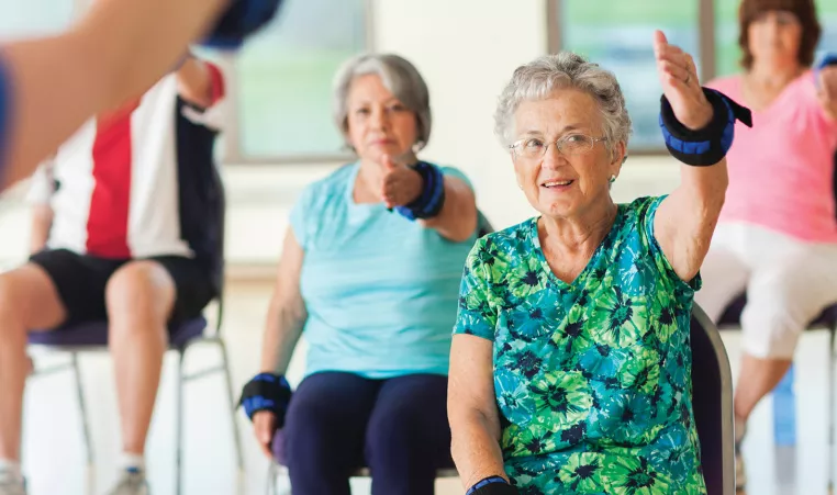 Participants exercising in a healthy living class