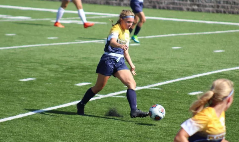 Bailie M. playing soccer