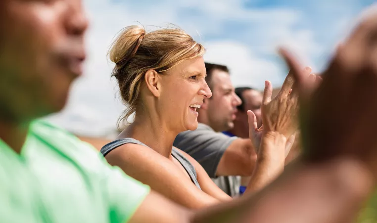 Image of sports parents watching a game