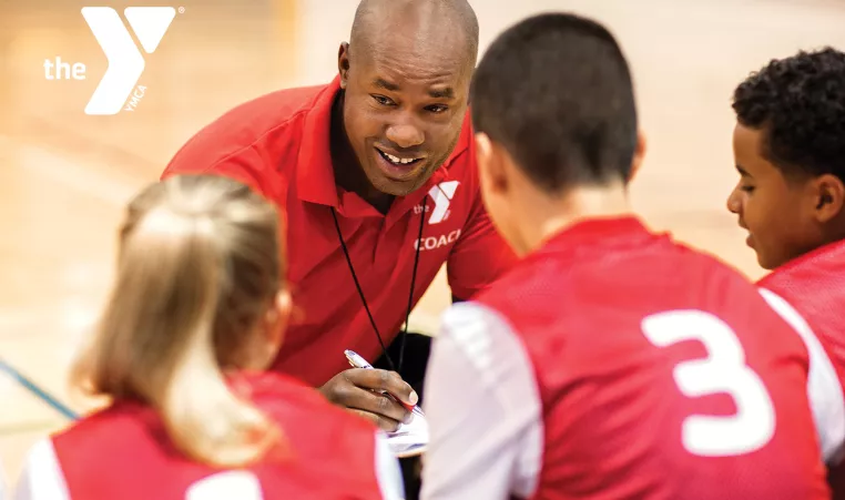 Image of a youth basketball coach