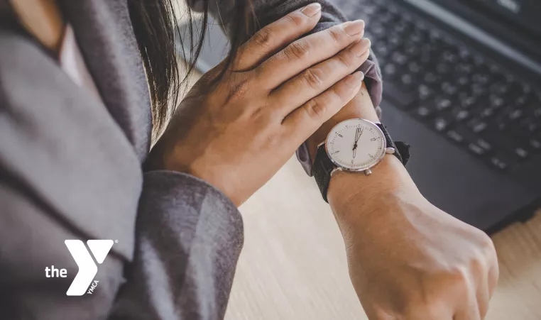 Woman looking at her watch