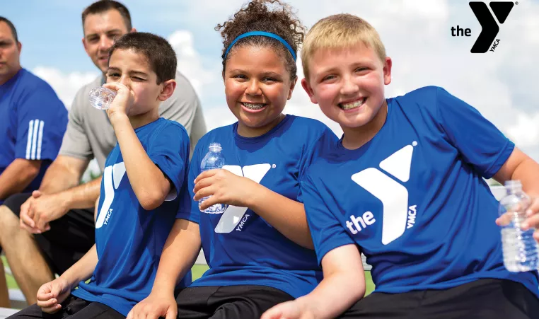 Kids sitting on a sports sideline