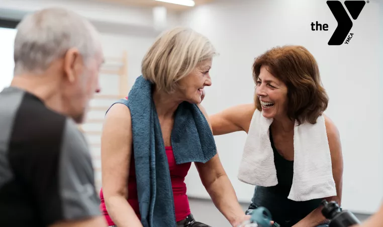 Older adult friends chatting at the gym