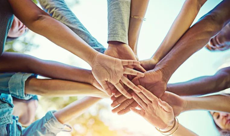 group of people holding hands