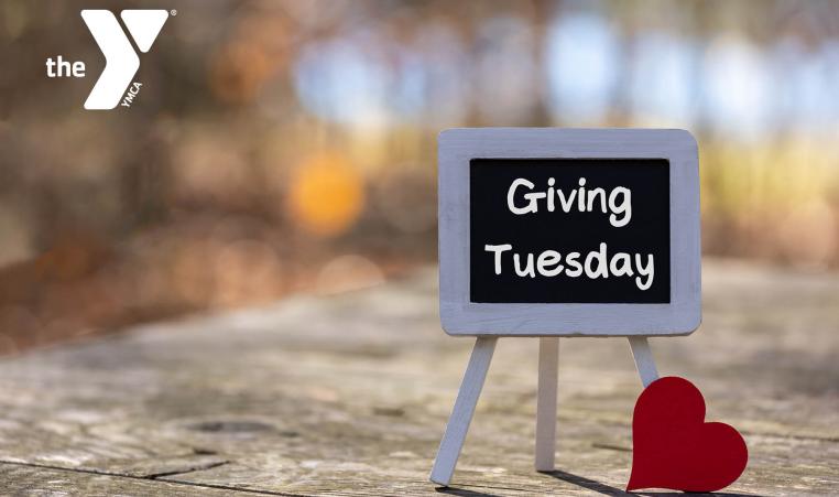 Giving Tuesday sign on a picnic table outdoors