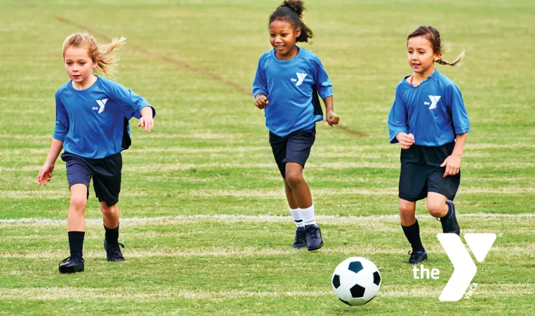 Young kids playing soccer