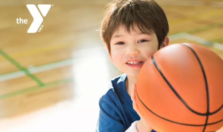 Toddler holding a basketball