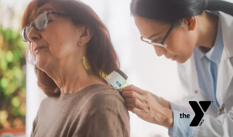 older woman getting a treatment from a doctor