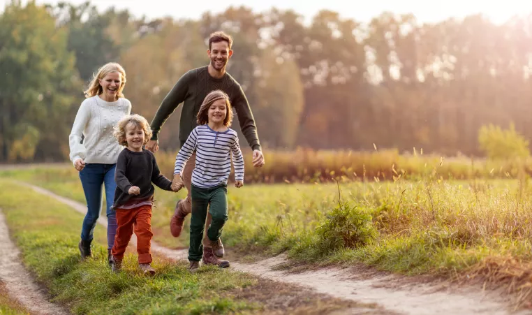 Family taking an outdoor walk together.