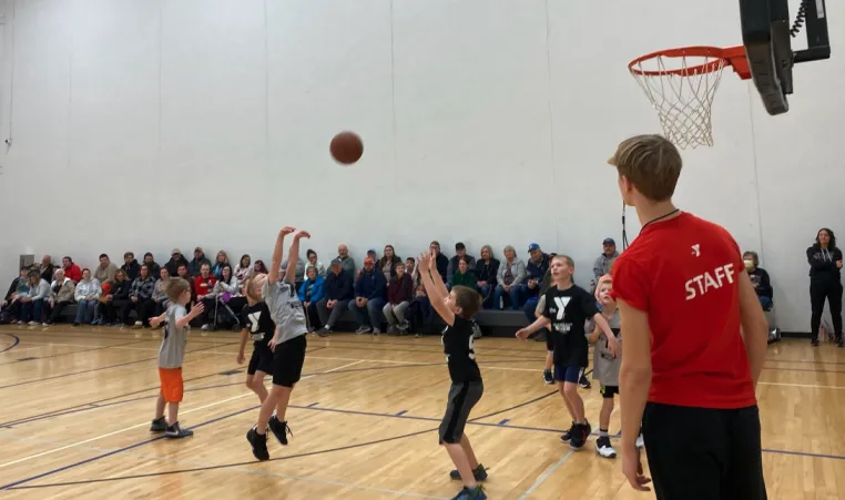 staff member officiating a basketball game