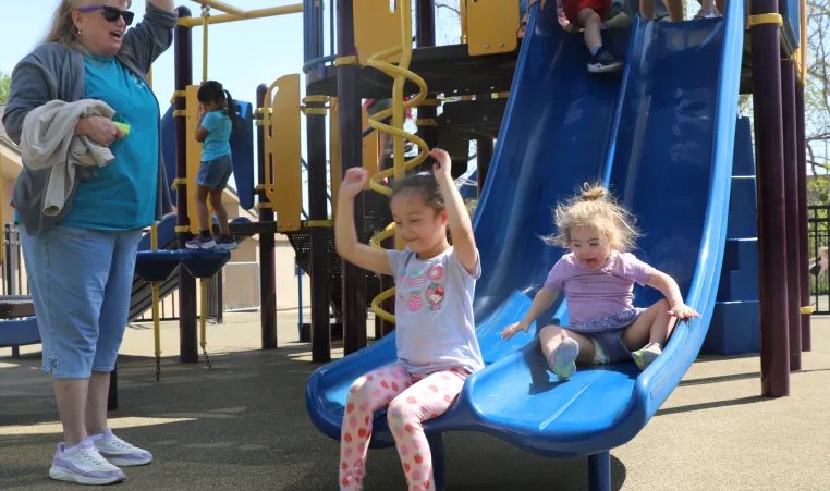 kids going down slide