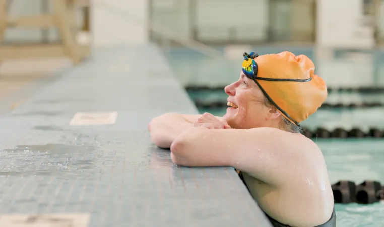 women looking out of pool