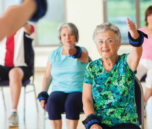Participants exercising in a healthy living class