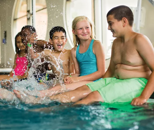 Kids splashing in the pool