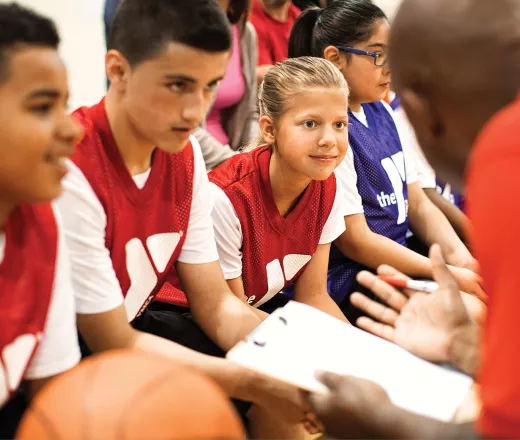 Kid's basketball team with their coach