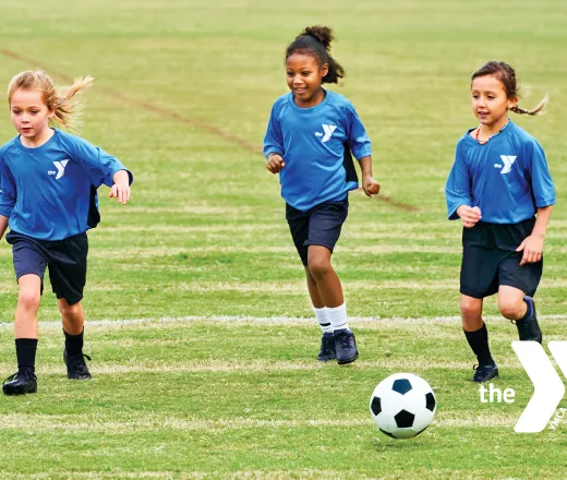 Young kids playing soccer