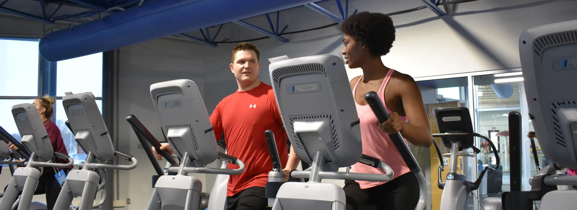 two people on exercise machine