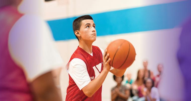 Youth shooting a basketball
