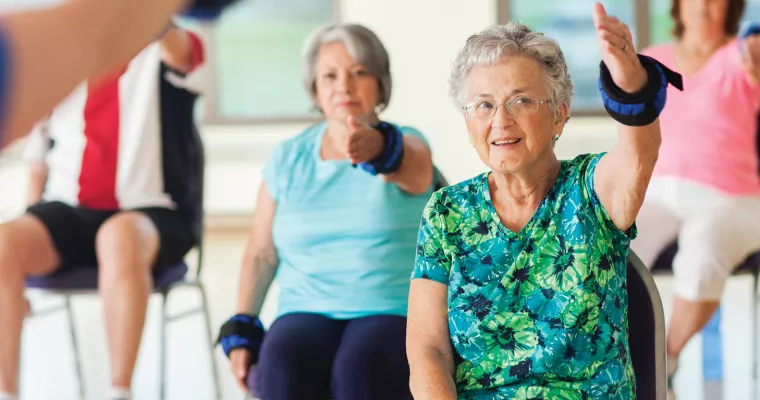 Participants exercising in a healthy living class