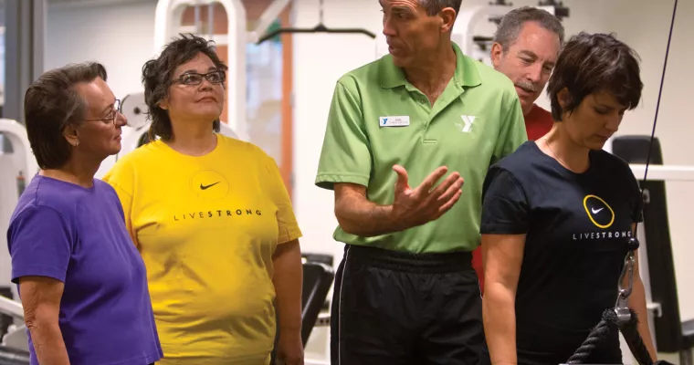 Livestrong group getting exercise instruction