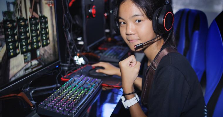 Teen girl playing video games