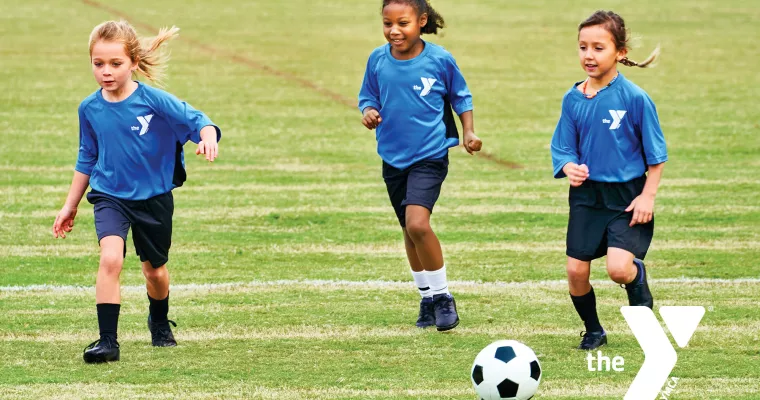 Young kids playing soccer