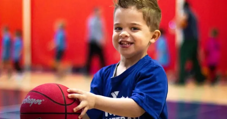 child with basketball 