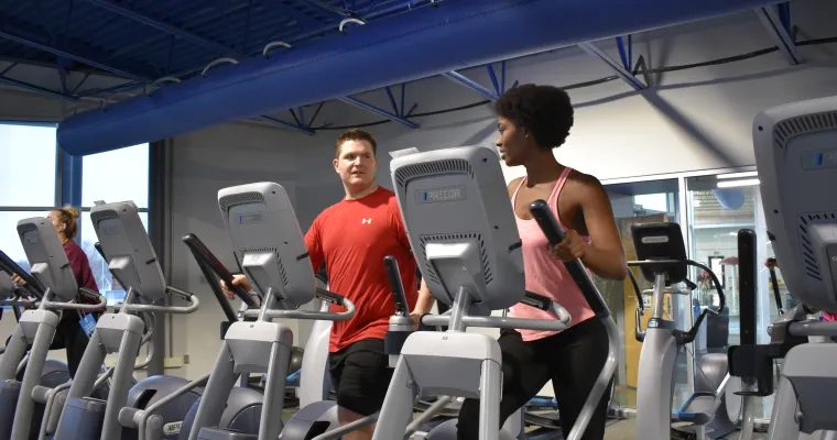 two people on exercise machine