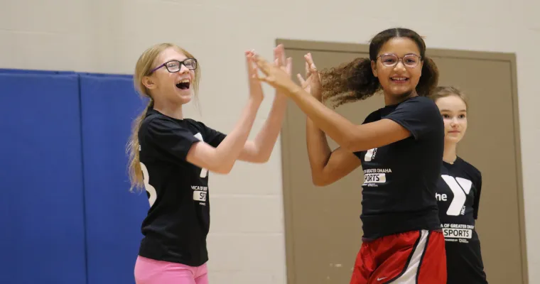girls high fiving